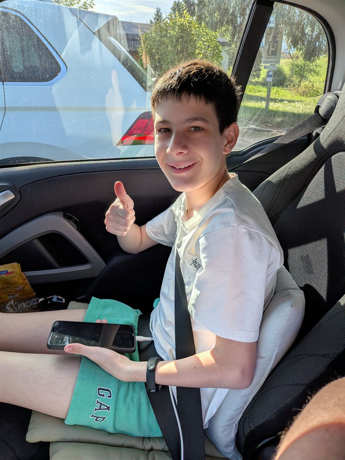 Co-pilot giving thumbs up from the back seat